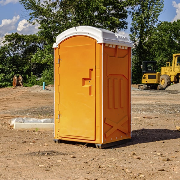 how often are the portable restrooms cleaned and serviced during a rental period in Huguley